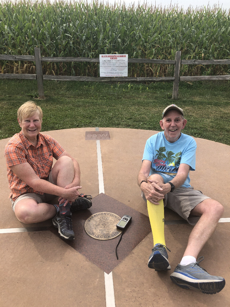 The Harrells forego the nearby benches to rest atop the confluence point.