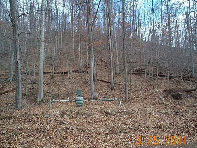 Gas meter on hillside 100' down the hill (South of) the Confluence.