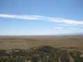 #11: Looking south along the fenceline from the top of the butte. You can see the road to the ranch manager's residence and even the smokestack due south