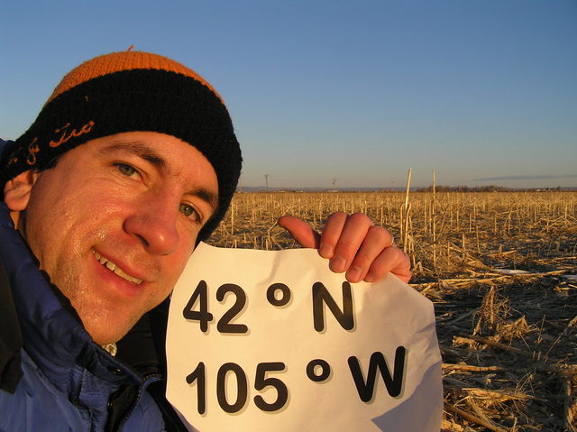 Joseph Kerski, standing in a cornfield on an early morning confluence visit.