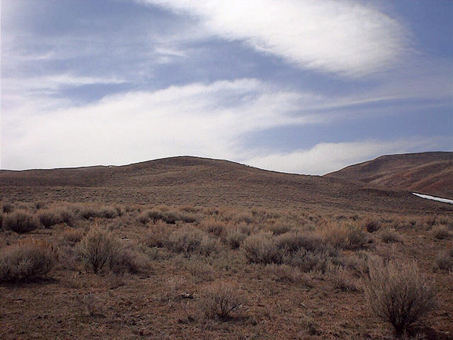 West: Un-named hill hiding Red Mountain.