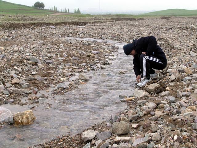 Washing in mountain stream