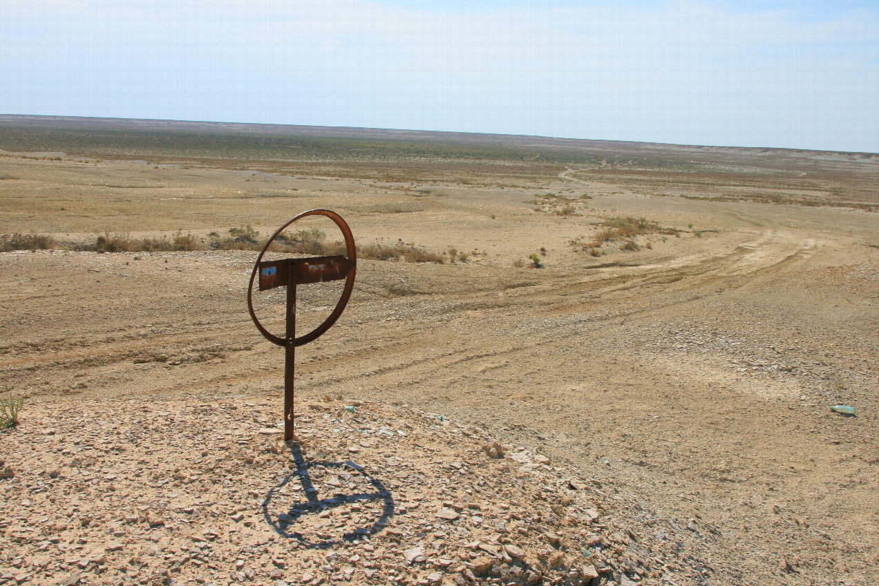 rusty signpost at beginning of depression