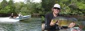 #5: RICARDO AND ALFREDO ON THE BOAT, AND RICARDO WITH HIS HUGE 11.5 POUNDS PEACOCK BASS FISH