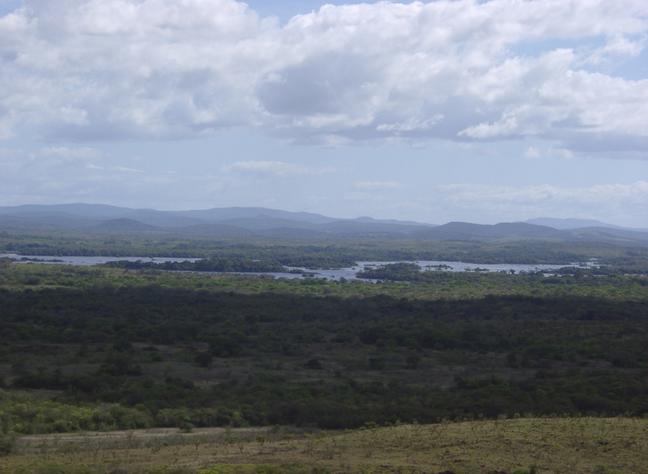 ~10 km to the SOUTH, on the other side of the river CARONI