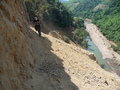 #5: Natie nervously attempting to cross the perilous cat-track with a deathly drop below.